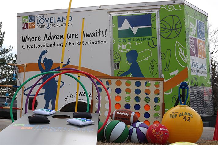 outdoor games displayed in front of mobile recreation trailer