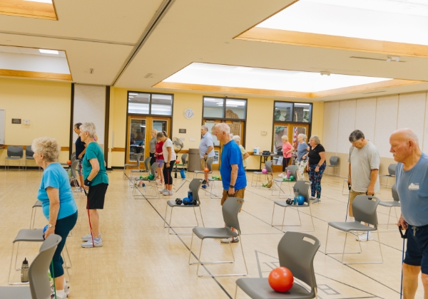 Several people in a wellness class at the Senior Center.