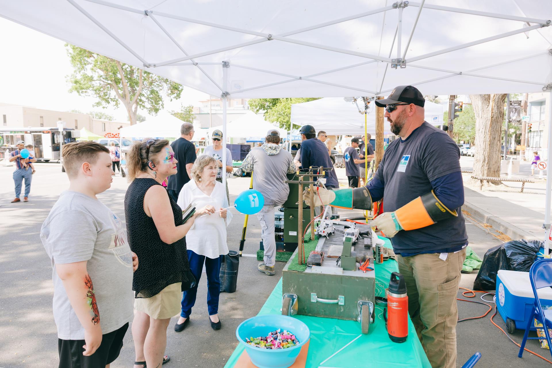 Photograph of electric division interacting with crowd at Passport to Power