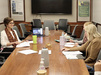 Commissioners attend a meeting