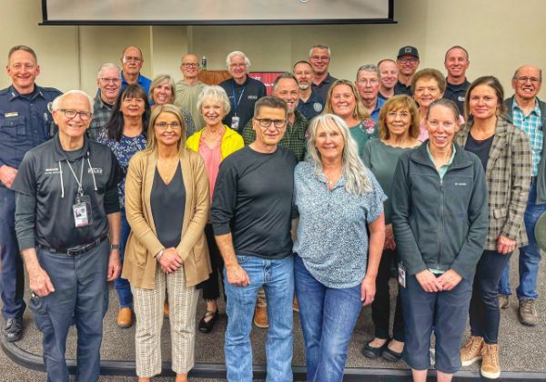 Several people standing for a group photo.